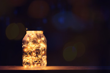 Lights in old retro style lantern with sparkling bokeh lights