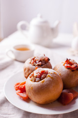 Home healthy healthy breakfast - tea, dried fruits, baked apples with honey. Cozy homemade tea