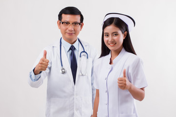 doctor and nurse, medical team giving thumb up