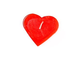 Fototapeta premium Extinguished red candle in shape of heart isolated on white background, top view
