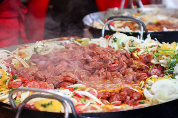 street food, hot dogs on the grill, grilled sausages on the grill