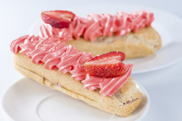 Appetizing sweet dessert. Cake with cream in a white plate
