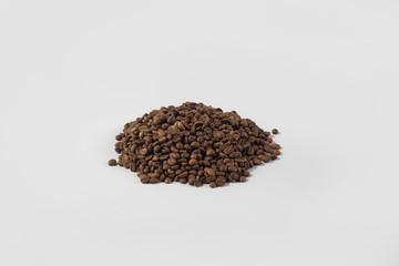 beautiful pile of coffee grains on a white background