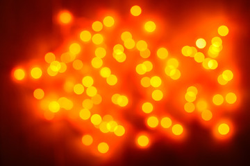 Christmas background. Festive gold abstract background with bokeh defocused lights