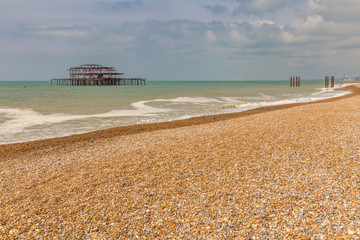 The remains of West Pier, seen from Brighton Beach, East Sussex, England, UK