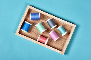 Thread rolls, Group of colorful thread on sewing desk, Craft, sewing and needlework concept.
