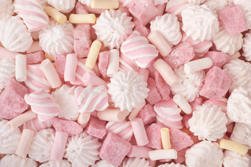 Sweet food background with marshmallows and strawberry sugar with meringues