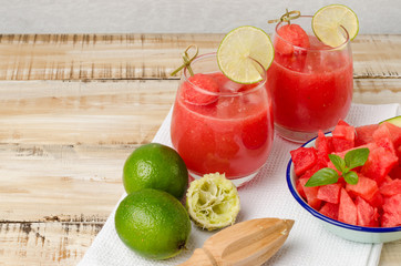 Watermelon fresh juice with mint leaves and lime citrus