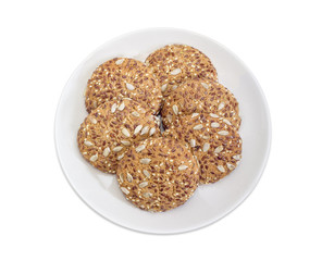 Cookies sprinkled with sesame, flax and sunflower seeds on dish