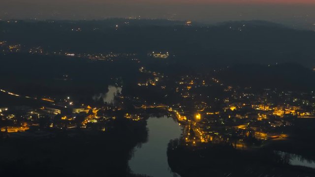 Timelapse of a Small Town by ther River in Italy at Sunset