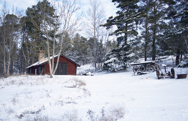 Old falu red blacksmith house a cold winter day