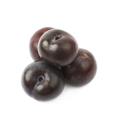 Pile of black plums isolated