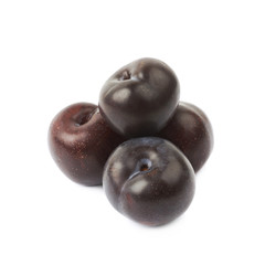 Pile of black plums isolated