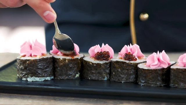 Sushi, cream cheese and caviar. Delicious maki rolls close up.