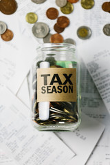 Tax Season money jar with receipts