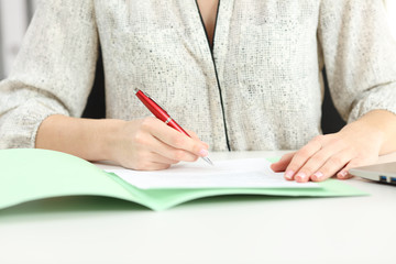Businesswoman hand signing a contract