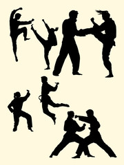 Couple exercising karate martial art silhouette 04. Good use for symbol, logo, web icon, mascot, sign, or any design you want.