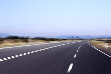 empty asphalt road with beautiful lake