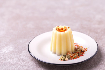 Indian kulfi dessert, ice cream with safron, mint, nuts