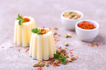 Indian kulfi dessert, ice cream with safron, mint, nuts