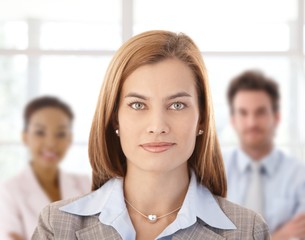 Fototapeta premium Businesswoman and colleagues in office