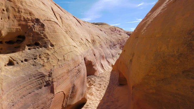 Camera Movement On A Dry Gorge With Smooth And Wavy Rocks Of The Red Canyon 4K
