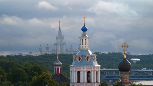 Moscow, Russia. Domes Andreevsky Male Monastery. In the background, the building of Moscow State University. Slow motion from 120 fps