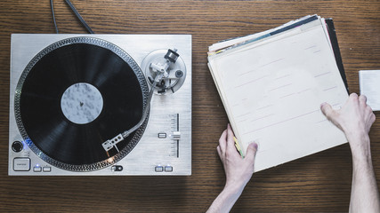 overhead view of the turntable with the vinyl records collection