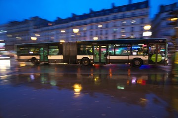 Paris,France-January 22,2018: Panning of Paris Bus line 80 on Boulevard de Clichy near Place de Clichy in the early rainy morning

