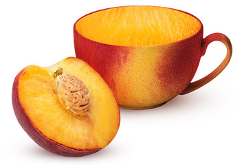 Mug of ripe peach fruit one cut in half with bone