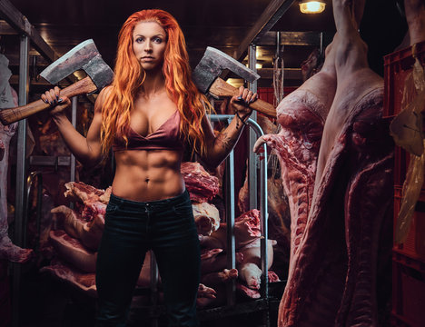 Redhead female in a meat factory.