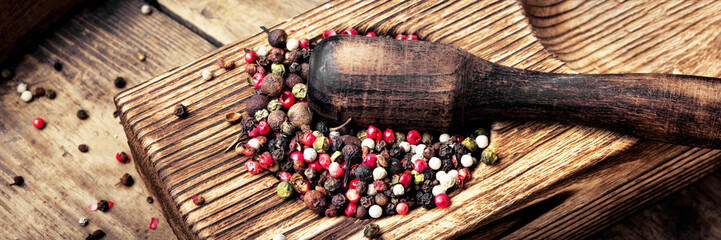 peppercorn in rustic mortar