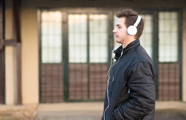 Man listening music with his headphones