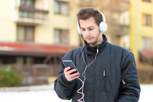 Man listening music with his headphones
