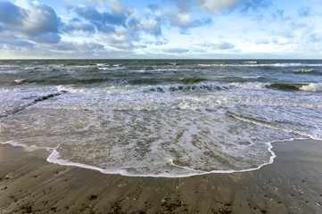 Sea coast. Waves and storms at sea. Waves on the Baltic Sea.