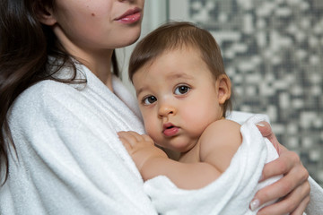 mother in a Bathrobe and with a child
