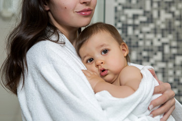 mother in a Bathrobe and with a child