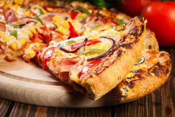 Homemade pizza with bacon, paprika and corn