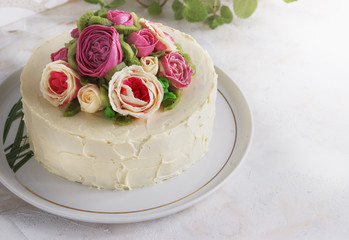 Birthday cake with flowers rose on white background