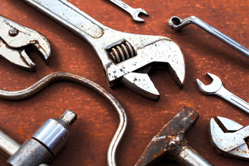 Working tools on wooden table background. top view