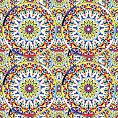 Seamless repeating pattern of colored mandalas