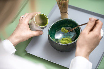 Making of green matcha tea