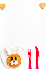 concept kid breakfast with pancake top view on white background
