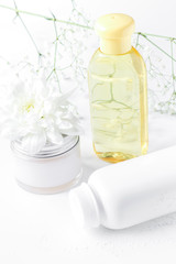 natural organic cosmetics with herbs for baby on white backgroun