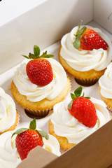 strawberry capcake in a cardboard box