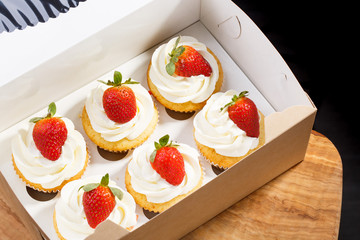 strawberry capcake in a cardboard box