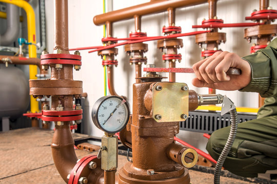 Levers on the oil manifold in the compressor room.