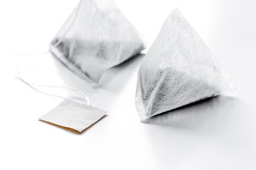 Pyramid teabags on white table mock-up