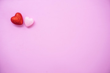 Obraz premium The 14th of February. St. Valentine's Day. Background with fluffy pink and red hearts on a pink background. Top view with copy space