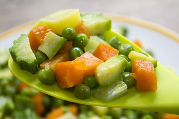 chopped vegetables on a spatula